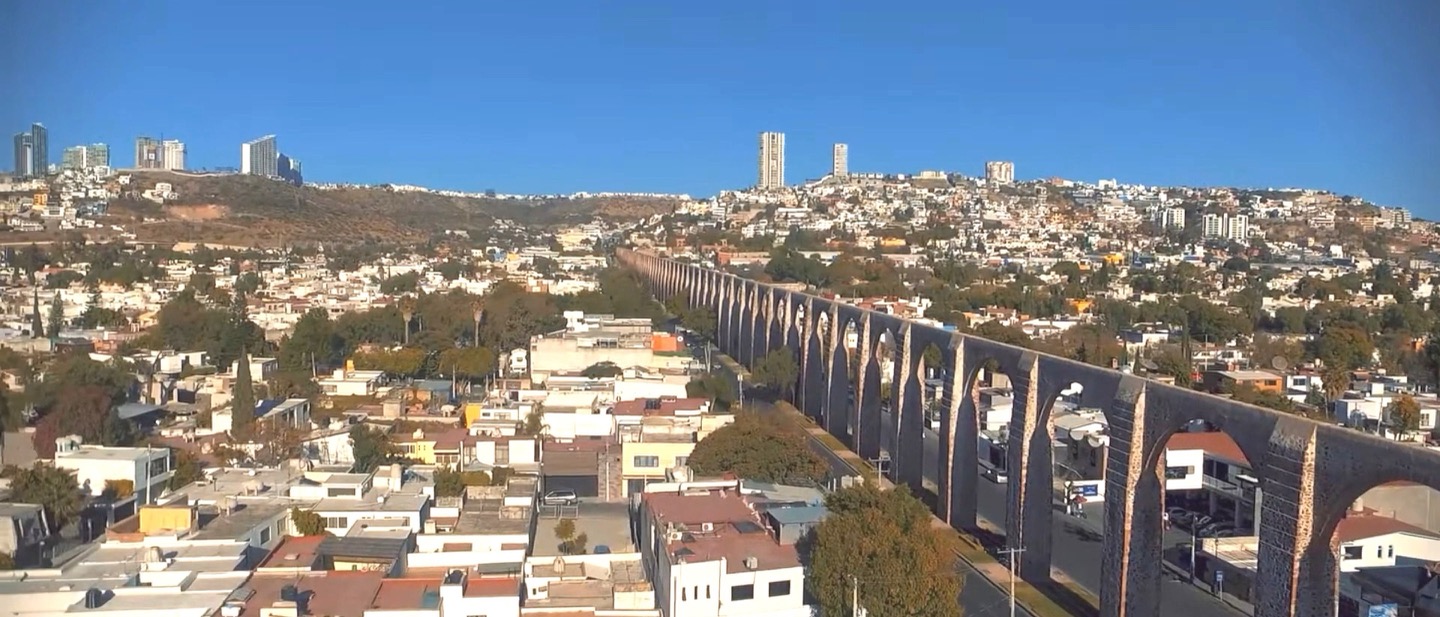Aerial panoramic view of the historic aqueduct arches spanning the Querétaro cityscape