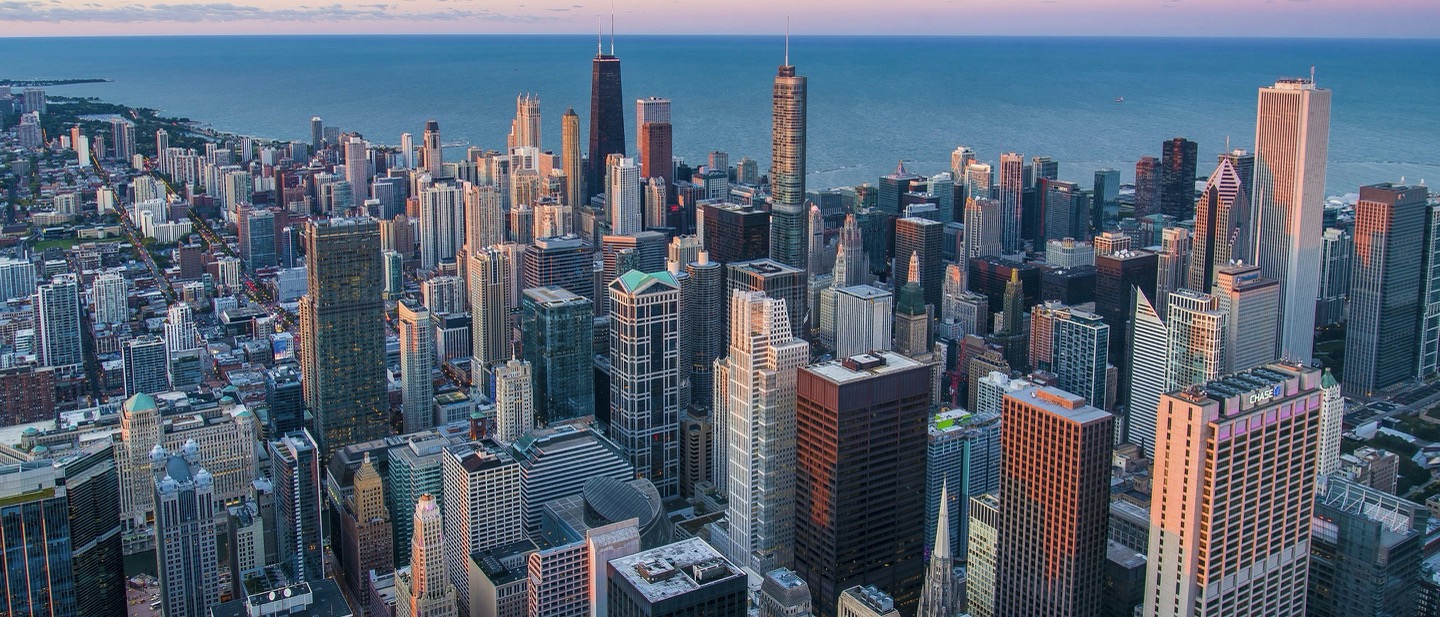 Chicago skyline at dusk with Lake Michigan reflecting city lights