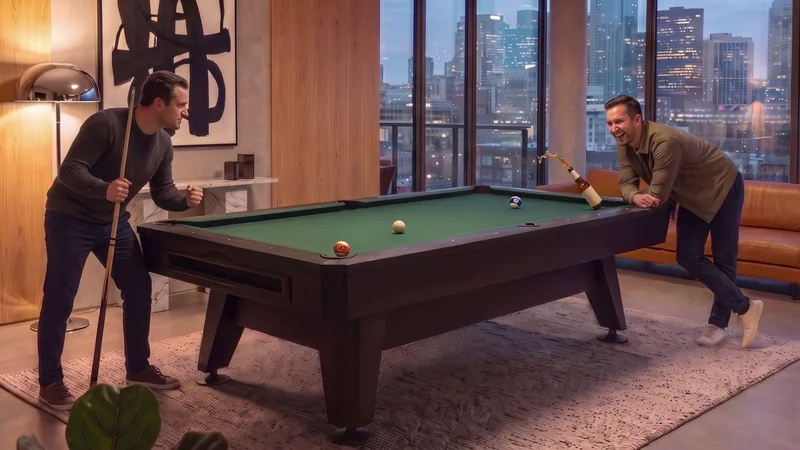Production frame from the Messes Happen TV spot footage with two people beside a pool table